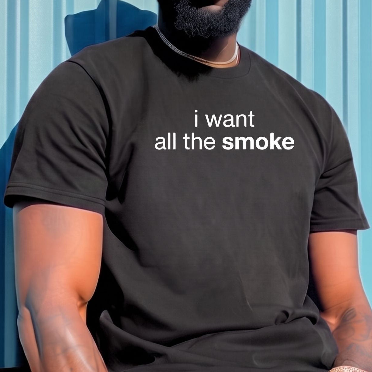 A man wearing a black bucket hat, sunglasses, and a black graphic t-shirt with the white text 'i want all the smoke' sits against a light blue corrugated metal wall.